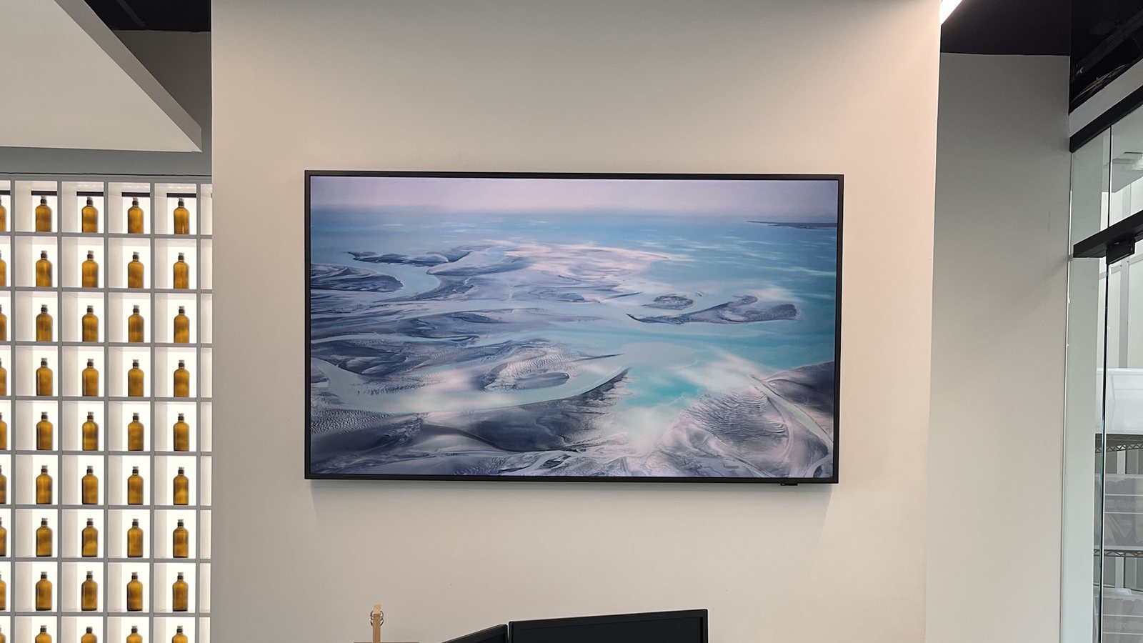 Samsung Frame TV in art mode mounted on an office wall — Argos AV commercial Frame TV installation
