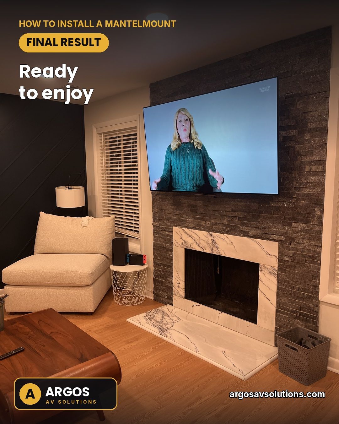 Finished TV on a MantelMount above a stacked-stone and marble fireplace