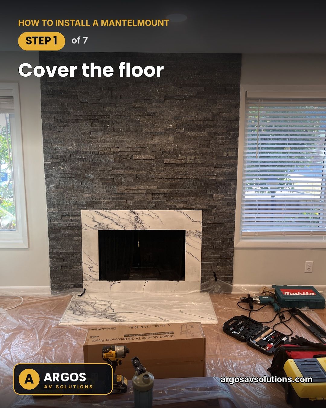 Stacked-stone fireplace with a marble surround, floor covered in plastic and tools laid out before a MantelMount install