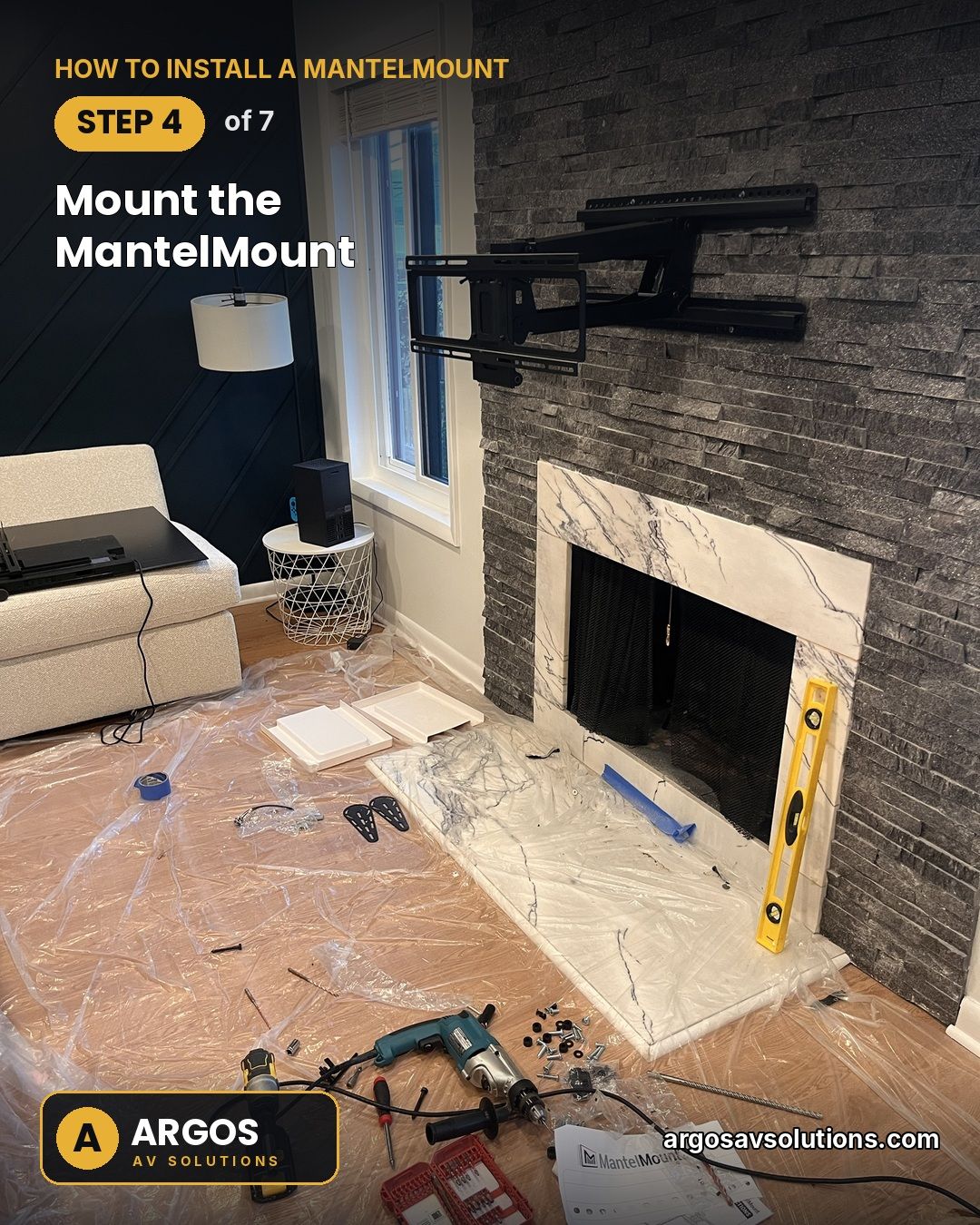 Articulating pull-down TV mount installed on a stacked-stone fireplace wall