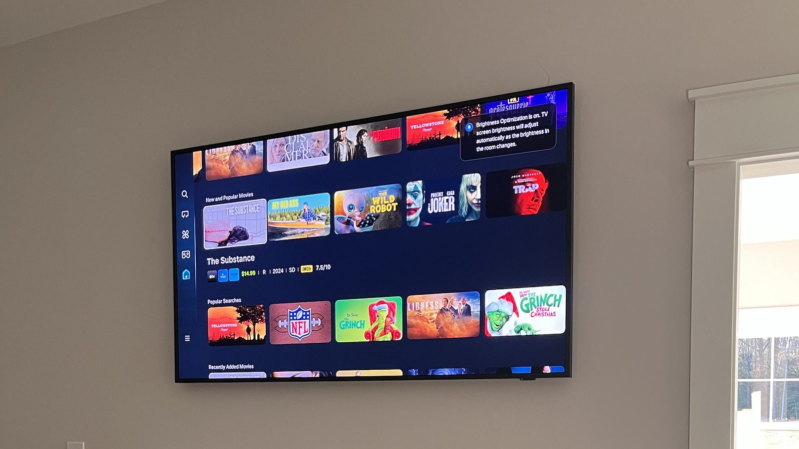 Samsung Frame TV mounted flush above a white fireplace mantel with no visible cables — Argos AV install